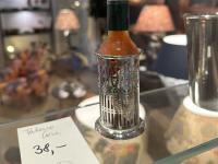 A Tabasco bottle holder. I kick myself every day for not getting this